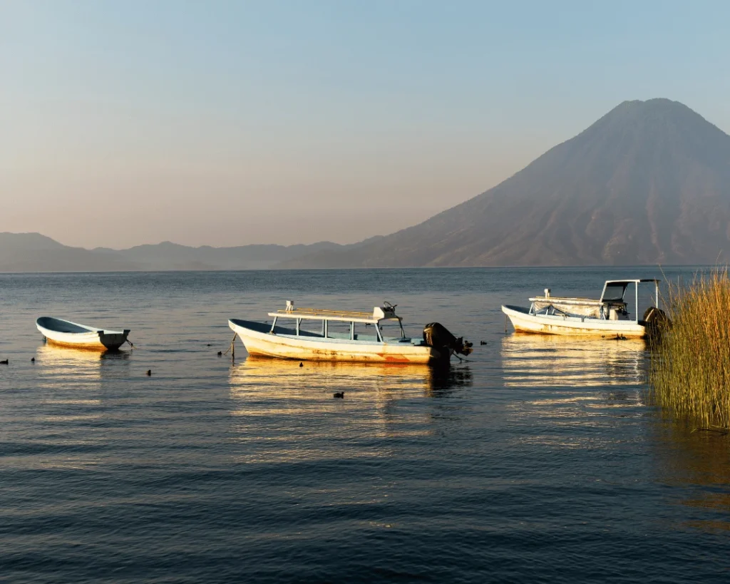 How do you get to Lake Macanché from Flores, El Remate and Yaxhá?